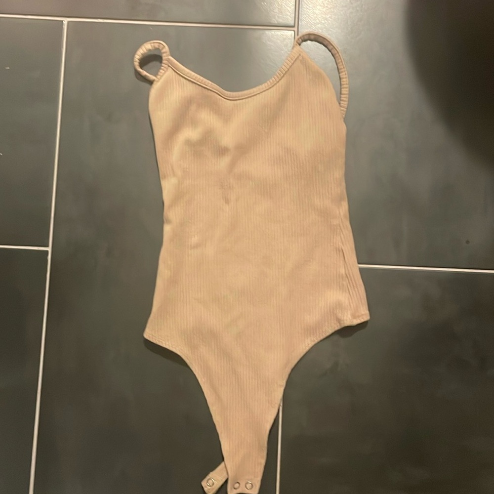 Tan colored body suit